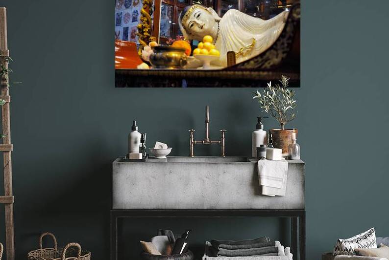 Reclining Buddha statue in temple with offerings in Shanghai by Marco Brivio