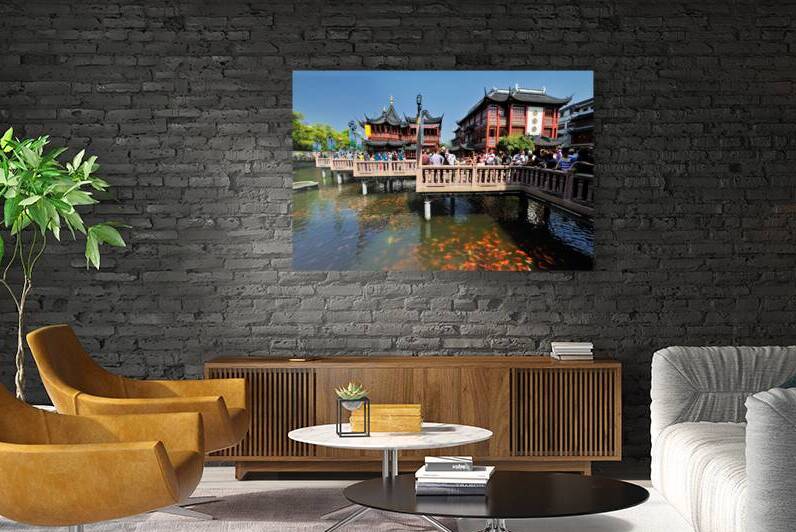 Crowds gather in traditional Chinese garden with fish pond in Sh by Marco Brivio