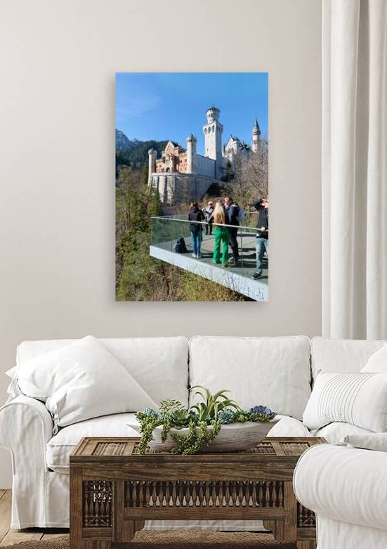 People stand on a platform looking at Neuschwanstein Castle in B by Marco Brivio
