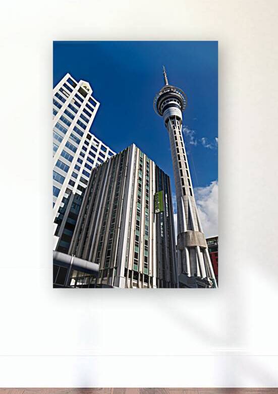 Sky Tower in Auckland showing city buildings and clear sky by Marco Brivio