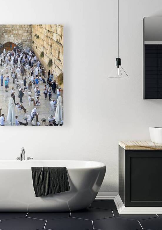Visitors pray at the western wall in Jerusalem during the day by Marco Brivio