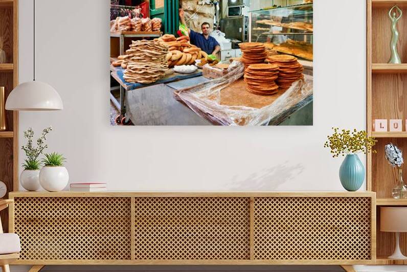 Baker working in the souq of Old City Jerusalem during the day by Marco Brivio