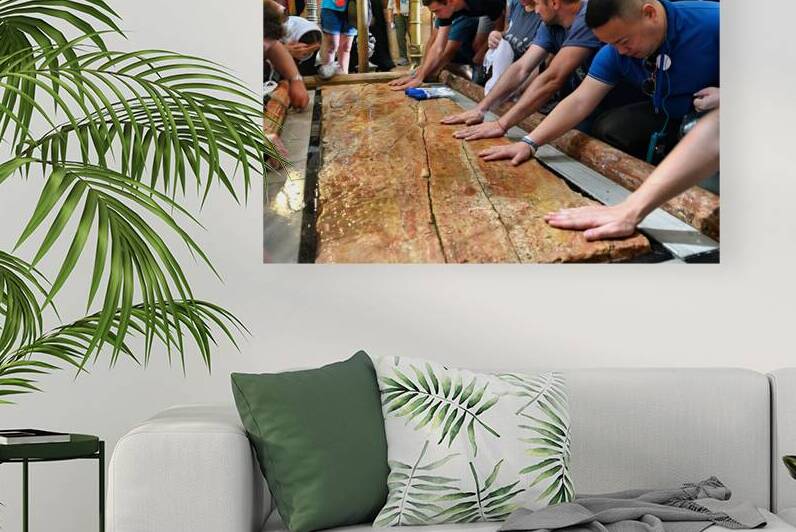 Visitors touch the stone of unction in the Holy Sepulchre by Marco Brivio