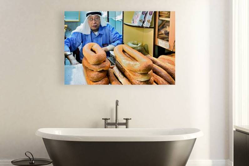 Baker selling bread in the souq of Old City Jerusalem by Marco Brivio