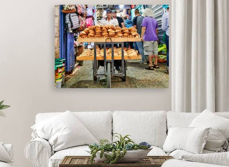 Baker pushes cart of bread through the old city of Jerusalem by Marco Brivio