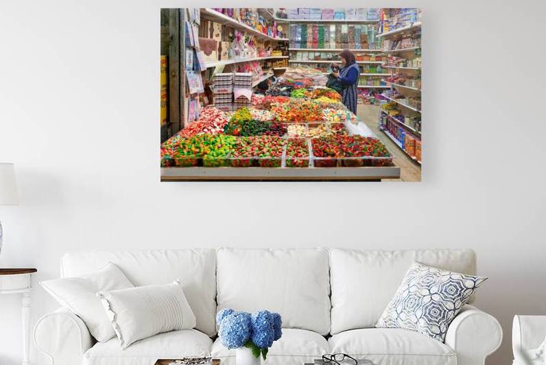 Grocer sells sweets and snacks in old city of Jerusalem by Marco Brivio