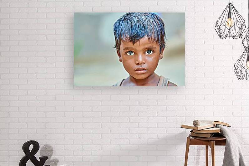 Portrait of a boy in Rajasthan India with a focused expression by Marco Brivio