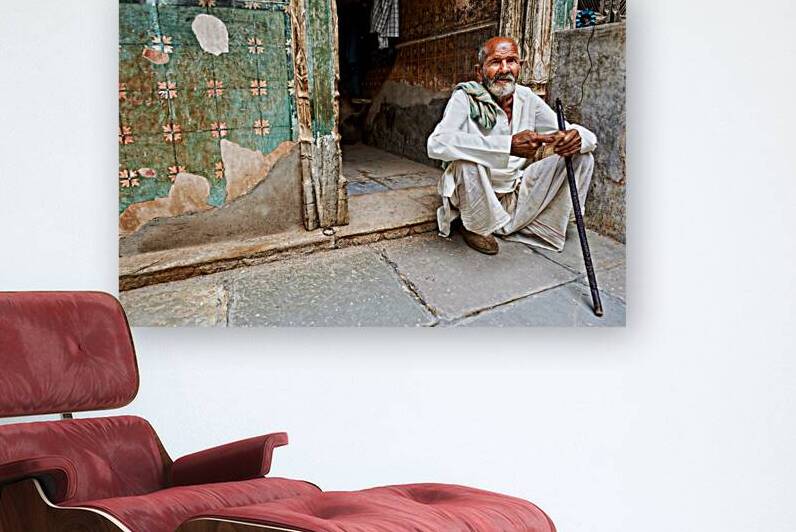 Old man sitting in a house in Mandawa Rajasthan India by Marco Brivio