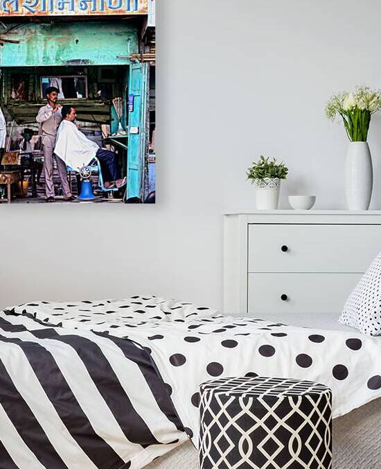 Barber performing haircut in Jaipurs local shop in Rajasthan by Marco Brivio