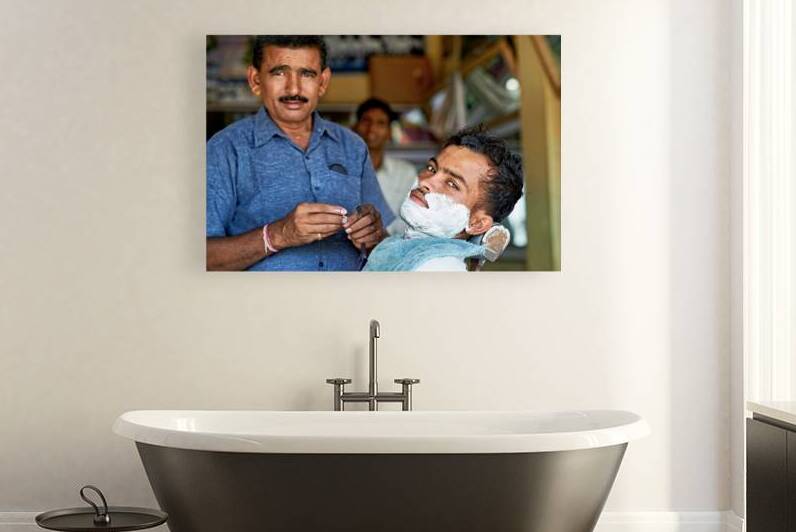 Barber at work in Khimsar Rajasthan India during a busy day by Marco Brivio