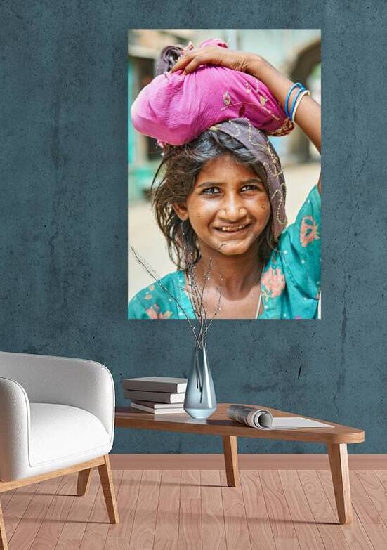 Portrait of a young girl carrying cloth in Mandawa Rajasthan by Marco Brivio