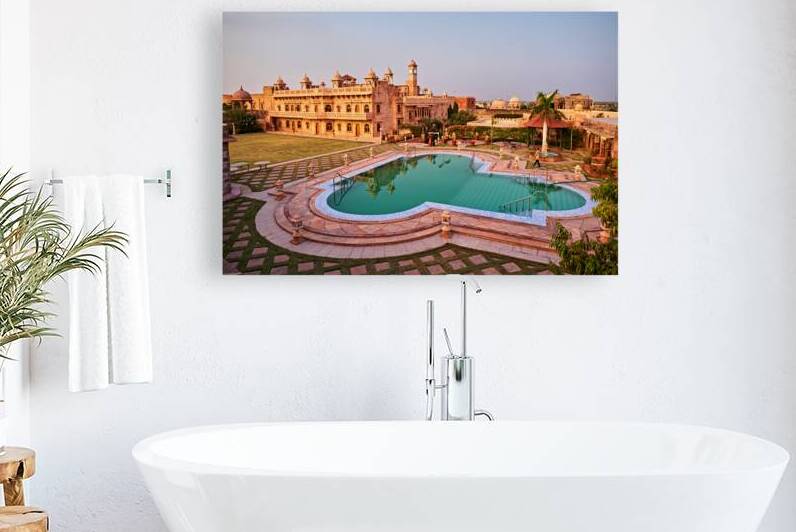 Visitors relax by the pool at Khimsar Fort in Rajasthan India by Marco Brivio