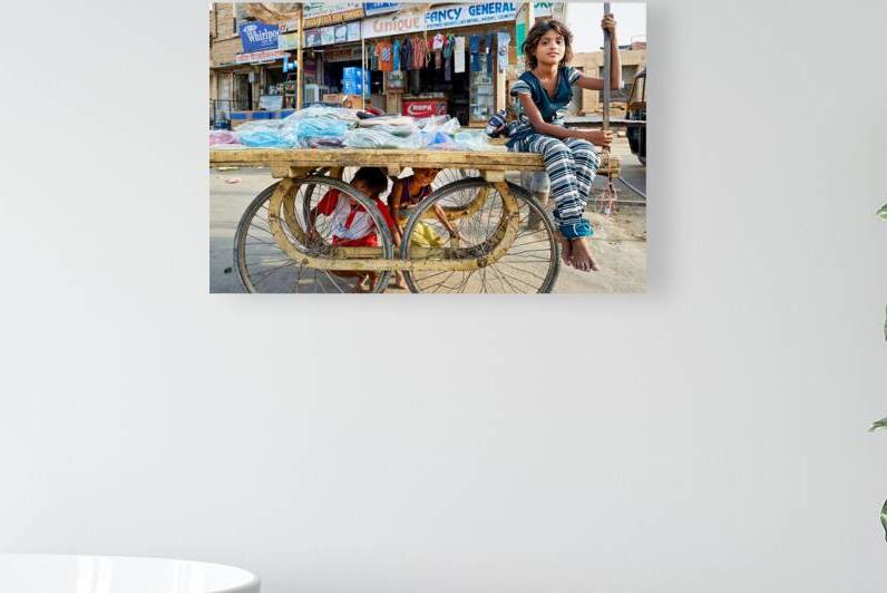 Children playing on a cart in Jaisalmer Rajasthan India by Marco Brivio