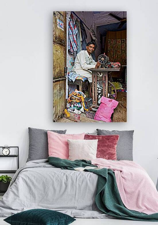 Man sewing clothes in Bundi Rajasthan during the day by Marco Brivio