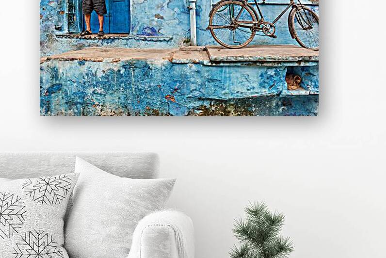 Father and son in Bundi with decorated house and bicycle by Marco Brivio