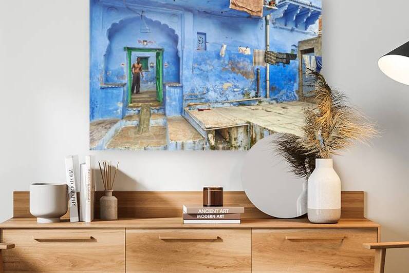 Man standing in decorated house in Bundi Rajasthan by Marco Brivio