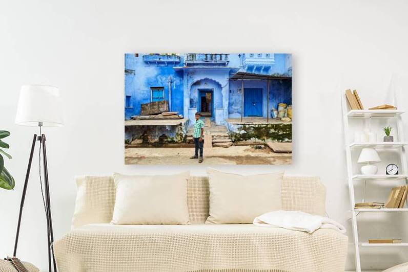 Decorated painted house in Bundi with a boy standing outside by Marco Brivio