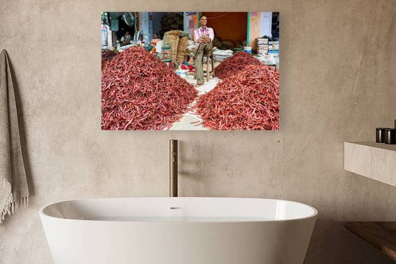 Man sells dried chili in Bundi market Rajasthan India by Marco Brivio