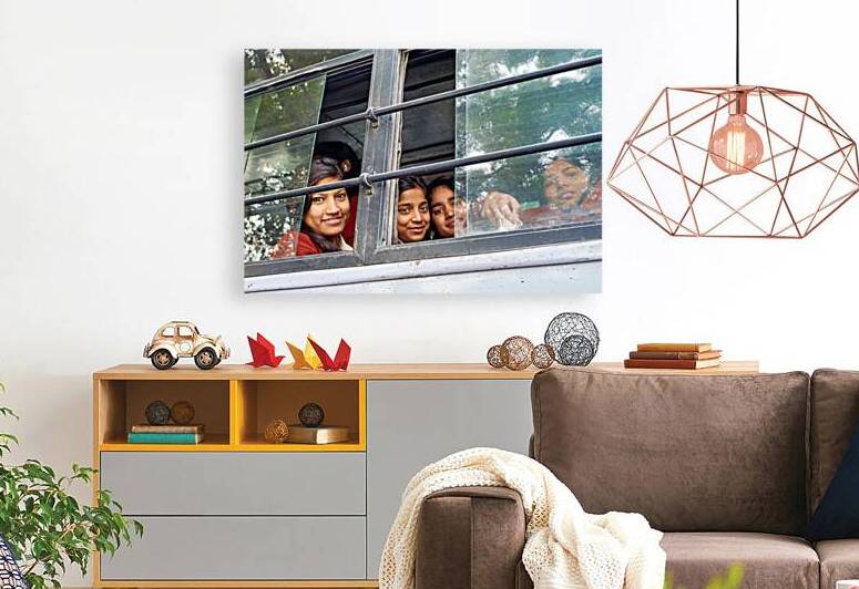 Girls traveling on a bus in Delhi India during daytime by Marco Brivio