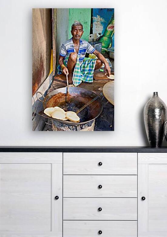 Cooking sweets in Varanasi street market during daytime by Marco Brivio