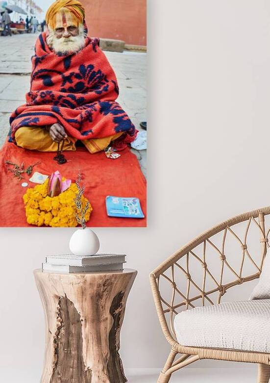 Holy man sadhu sits with offerings in Varanasi Uttar Pradesh by Marco Brivio