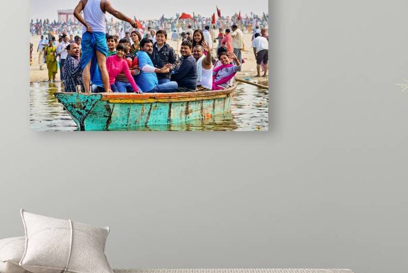People sit on a boat on the Ganges River by Marco Brivio