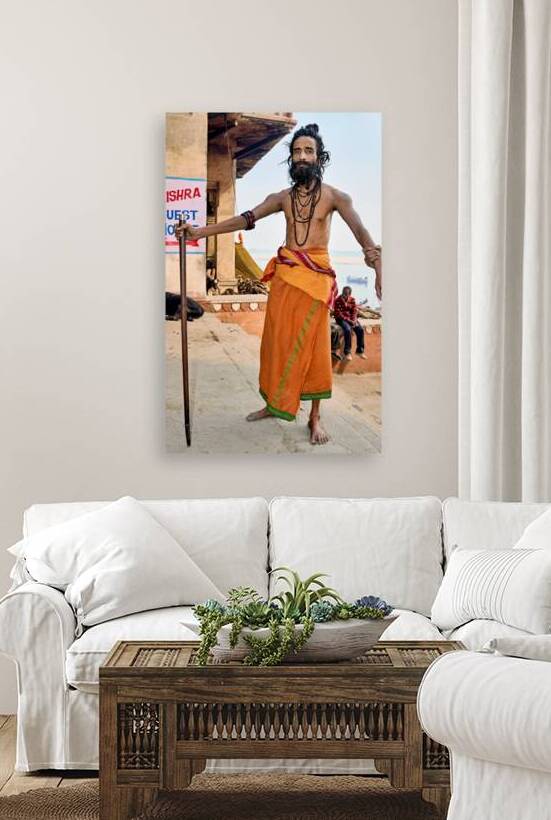 Sadhu stands near the Ganges River in Varanasi India by Marco Brivio