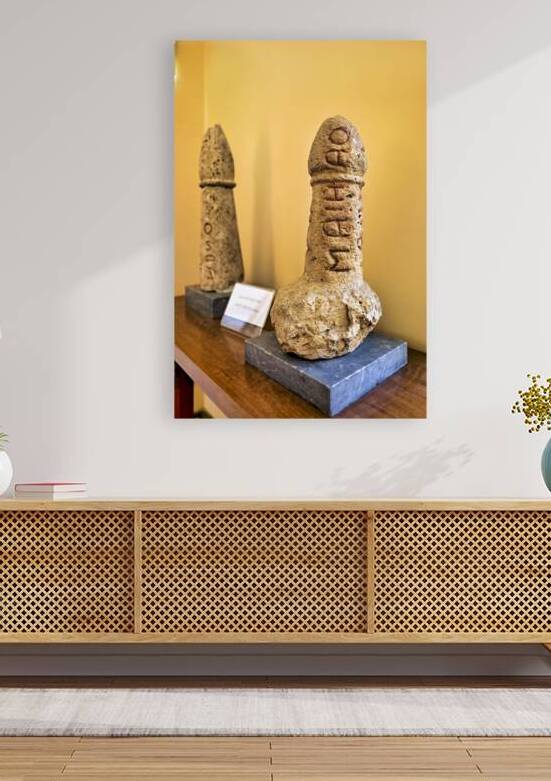 Statues of phallic symbols at National Archaeological Museum in  by Marco Brivio