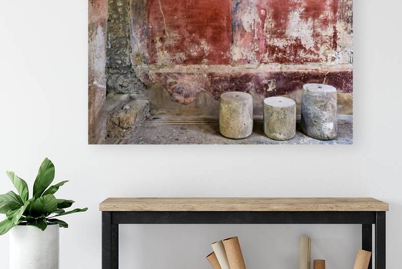 Pompeii site with stone seats and worn wall in Naples Italy by Marco Brivio