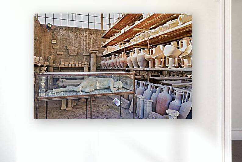 Pompeii site showing artifacts and a plaster cast of a victim by Marco Brivio