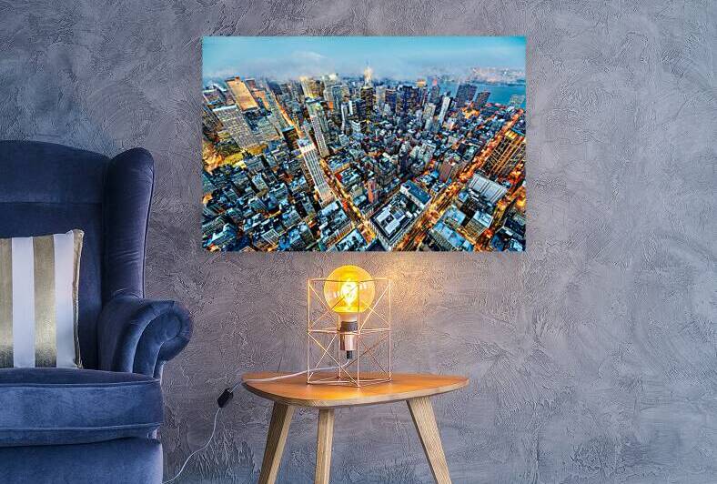 Aerial view shows Manhattan skyline with buildings and streets by Marco Brivio