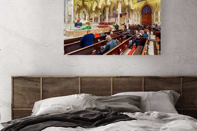 Faithful pray inside St. Patricks Cathedral in Manhattan New Y by Marco Brivio