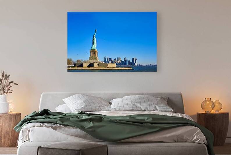 Statue of Liberty stands tall on Liberty Island in New York City by Marco Brivio