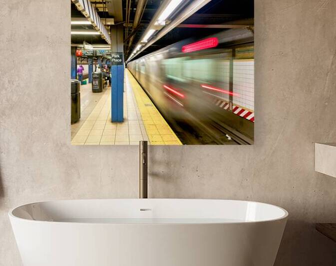 A subway train moves quickly at Park Place station in Manhattan by Marco Brivio