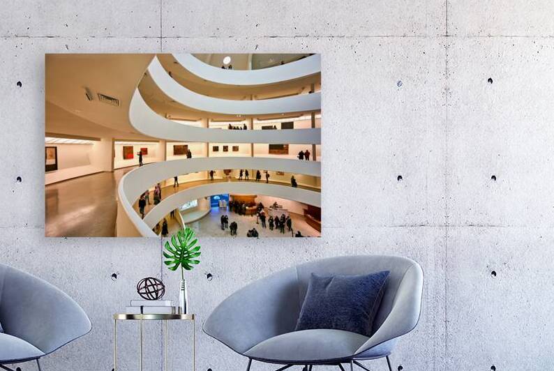 People walk and look at art inside the Guggenheim Museum in New  by Marco Brivio