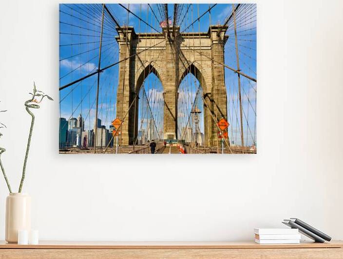 Walking on Brooklyn Bridge in New York City on a clear day by Marco Brivio