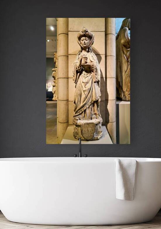 Sculpture of a woman holding a book in the Metropolitan Museum o by Marco Brivio