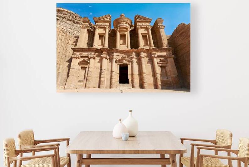 Visit to the Monastery at Petra in Jordan under clear blue sky by Marco Brivio