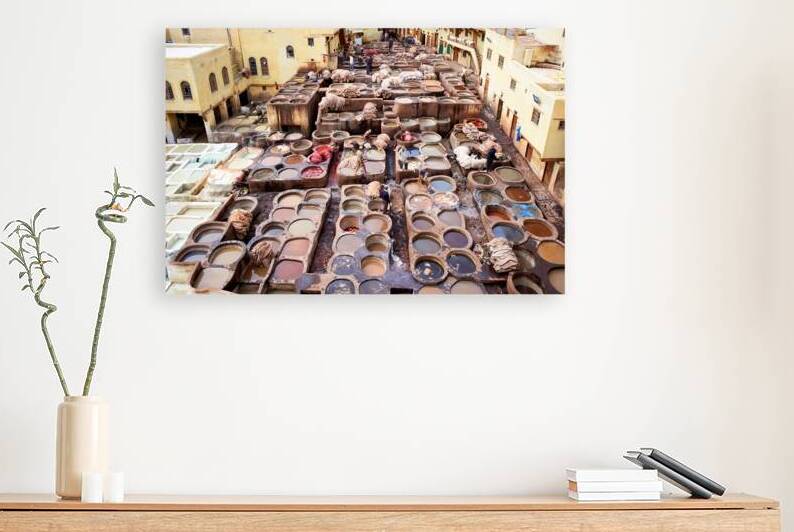 Chouara Tannery in Fez Morocco shows workers tanning leather by Marco Brivio