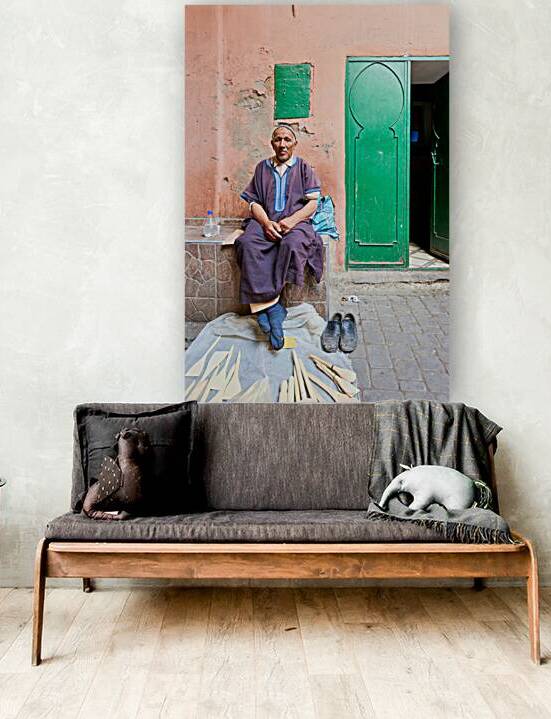 Portrait of old man sitting in Marrakesh Medina street by Marco Brivio