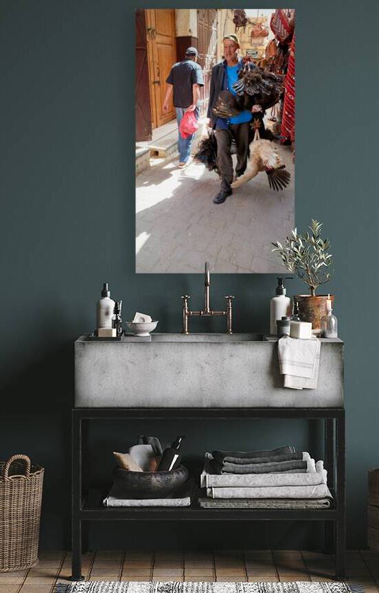 Man carries live turkeys through street in Fez Morocco by Marco Brivio