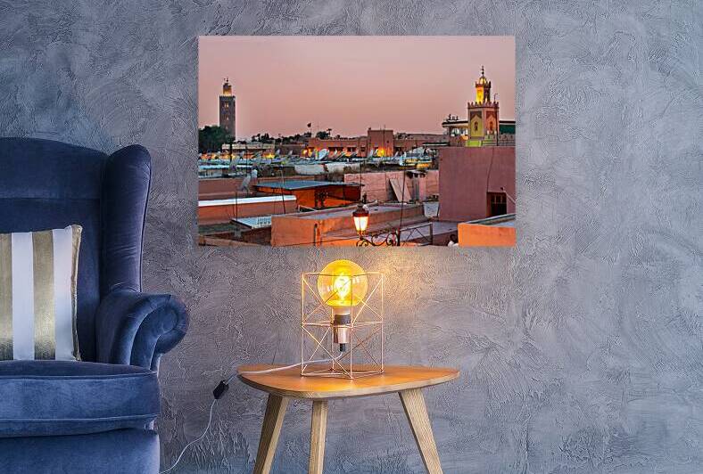 Cityscape of Marrakesh at sunset with buildings and minarets vis by Marco Brivio