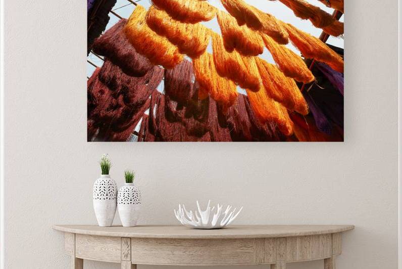 Colorful threads hanging in the dyers souk of Marrakesh Morocco by Marco Brivio