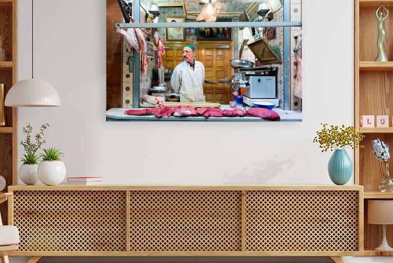 Butcher sells camel meat in the souk of Meknes Morocco by Marco Brivio