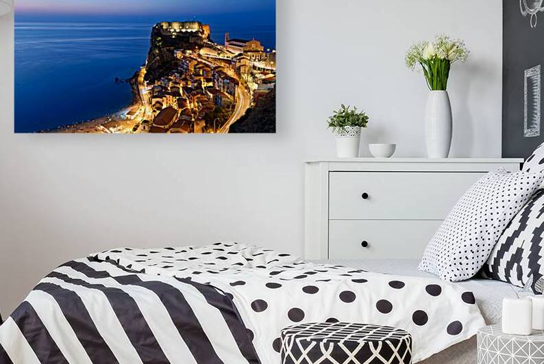 Illuminated Ruffo castle in Scilla Calabria at sunset over the s by Marco Brivio