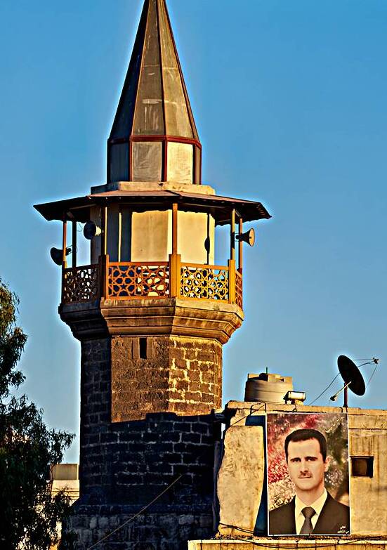 Large portrait of leader displayed on building in Damascus by Marco Brivio