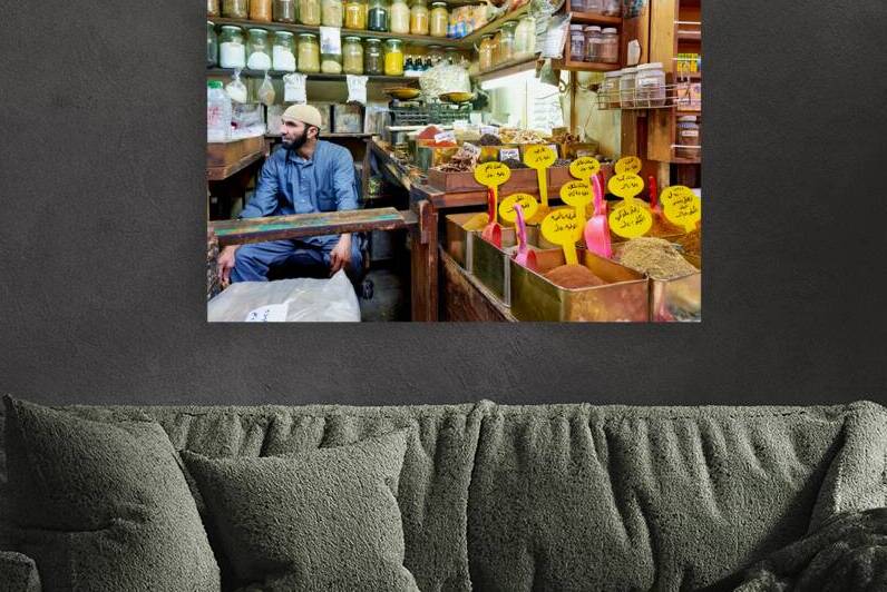 Market scene in Al Hamidiyah Souq showing spices and vendor in S by Marco Brivio
