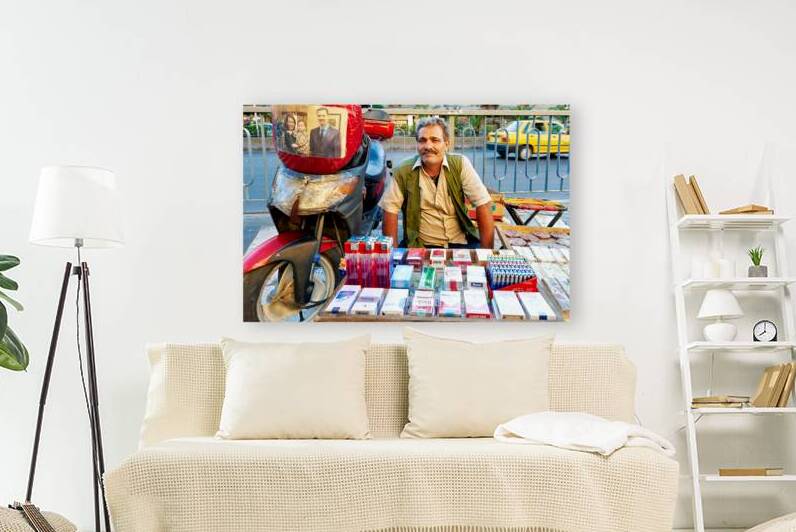 Man selling cigarettes near his motorcycle in Damascus Syria by Marco Brivio