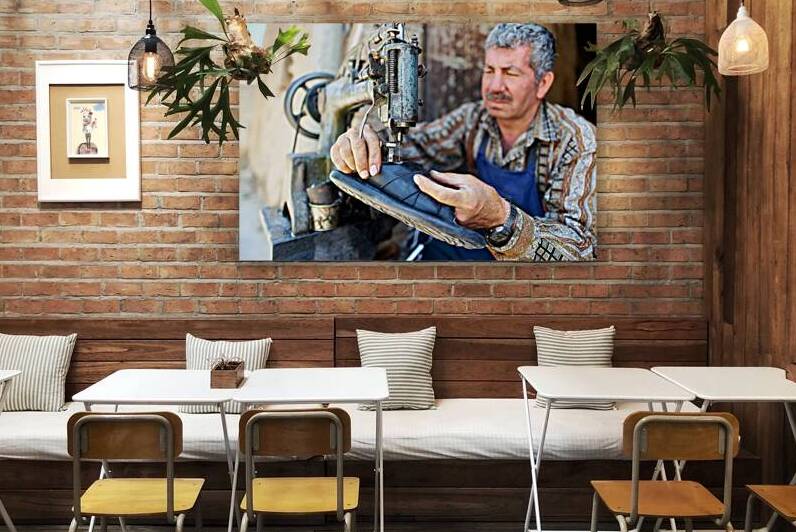 Shoemaker working in Aleppo souq in Syria by Marco Brivio