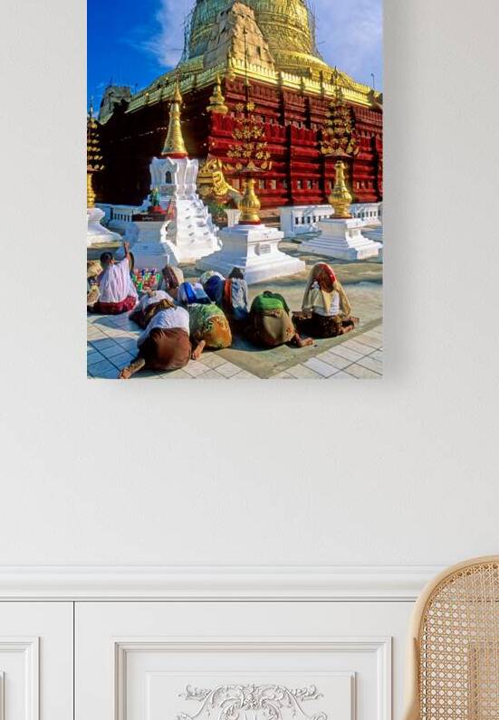 Visitors worship at Shwezigon Paya in Bagan Myanmar during the  by Marco Brivio